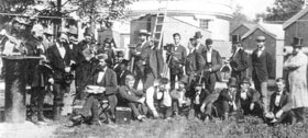Participents of the 1874 expeditions are seen here when they gathered on the grounds of the USNO to practice the big event. Prof Newcomb is seen seated in front and in the background and extreme right are some of the wooden huts that were used in the expeditions. (Journal of the History of Astronomy XXIX, 1998)