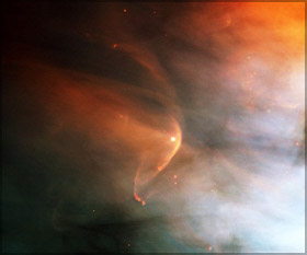 Bow shock, about half a light-year across, created from the wind from the star L.L. Orionis colliding with the Orion Nebula flow