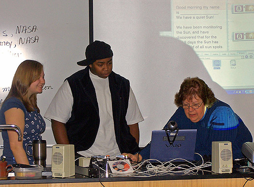 Elaine Lews, from the Sun-Earth Connection Education Forum, is on the right working with students from Barrow Highschool